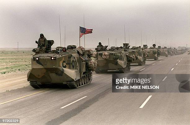 Photo taken 05 March 1991 of a convoy of US Army tanks driving down the road from Kuwait towards Dhahran in the Saudi desert as US troops begin their...