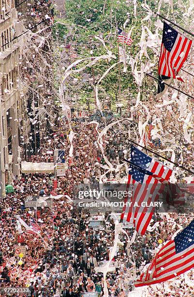 Thousands of Gulf War veterans are showered with ticker-tape as they march up Broadway Avenue during the Operation Welcome Home parade during the 10...