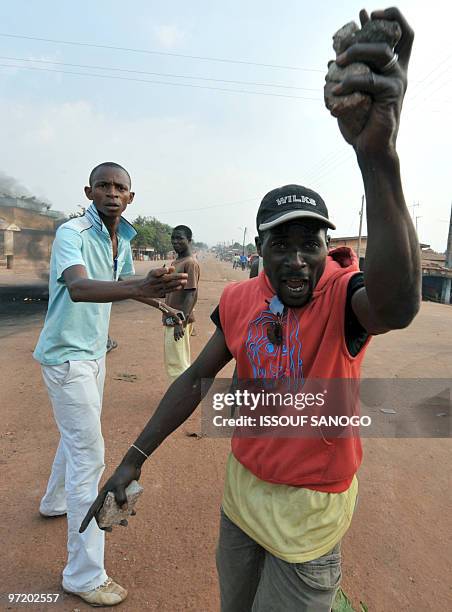 Opposition group members protest on February 20, 2010 the western town of Gagnoa against Ivorian President Laurent Gbagbo following deadly clashes...
