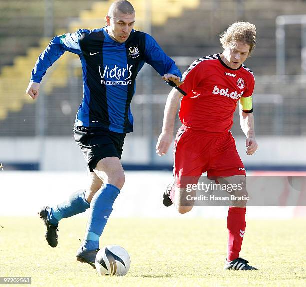 Velimir Grgic of Saarbruecken battles for the ball with Florian Dondorf of Lotte during the Regionalliga match between 1. FC Saarbruecken and...