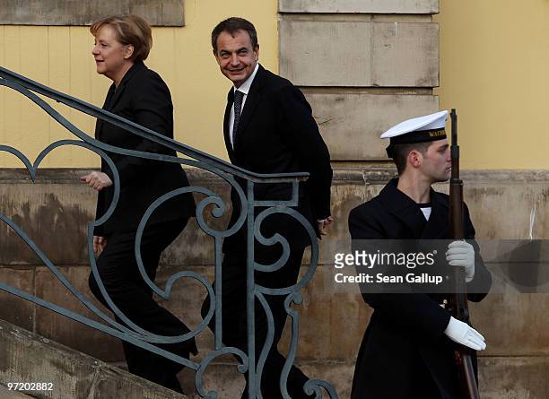 German Chancellor Angela Merkel greets Spanish Prime Minister Jose Luis Rodriguez Zapatero upon his arrival for bilateral talks on March 1, 2010 in...