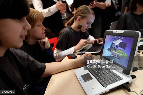 Children try out networked computer laptops in the Digitial Classroom at the Microsoft stand at the CeBIT Technology Fair on March 1, 2010 in...