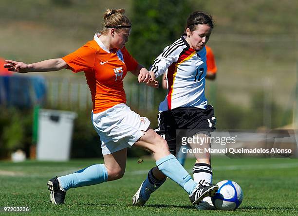 Nicole Rolser of Germany and Marissa Compier of Netherlands compete for the ball during the women's international friendly match between Germany and...