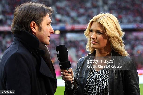 Sport reporter Jessica Kastrop talks to head coach Bruno Labbadia of Hamburg before the Bundesliga match between FC Bayern Muenchen and Hamburger SV...