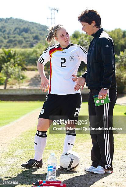 Head coach Maren Meinert of Germany gives instructions to Leonie Maier after the women's international friendly match between Germany and Netherlands...