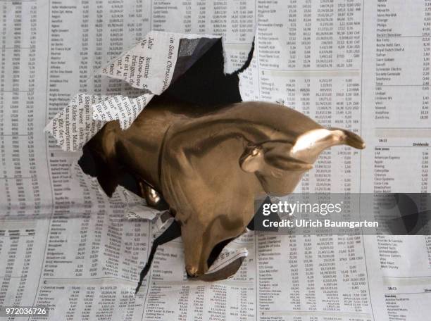 Symbol photo on the topics Bull , economy, economic situation, stock exchange, stock market numbers, upturn and downturn, etc. Bull breaks through...