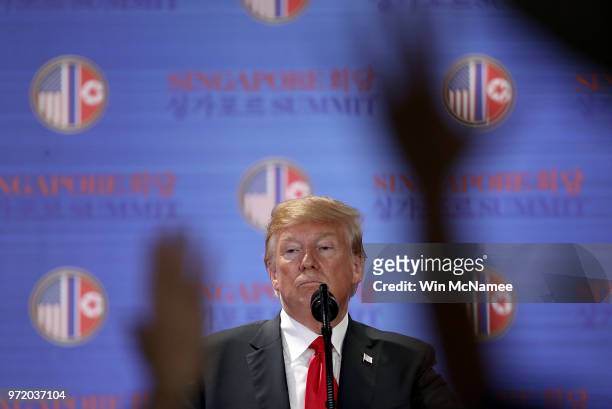 President Donald Trump answers questions during a press conference following his historic meeting with North Korean leader Kim Jong-un June 12, 2018...