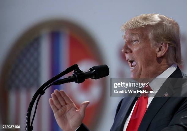 President Donald Trump answers questions during a press conference following his historic meeting with North Korean leader Kim Jong-un June 12, 2018...