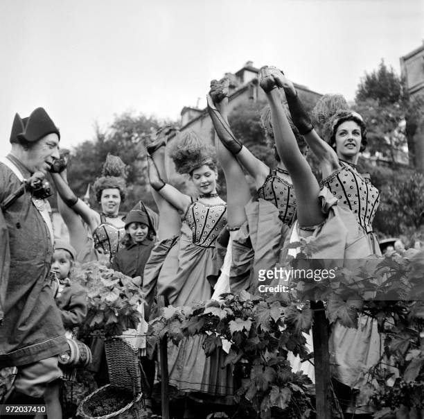 Picture taken on October 4, 1956 showing dancers of French Cancan taking part to traditional grape harvest on Montmarte hill at Paris.