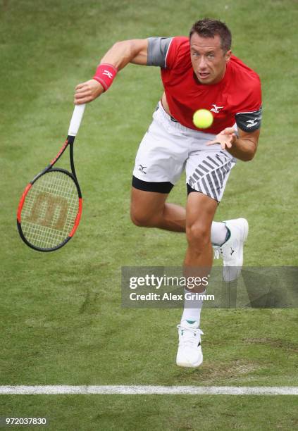 Philipp Kohlschreiber of Germany serves the ball to Denis Istomin of Uzbekistan during day 2 of the Mercedes Cup at Tennisclub Weissenhof on June 12,...