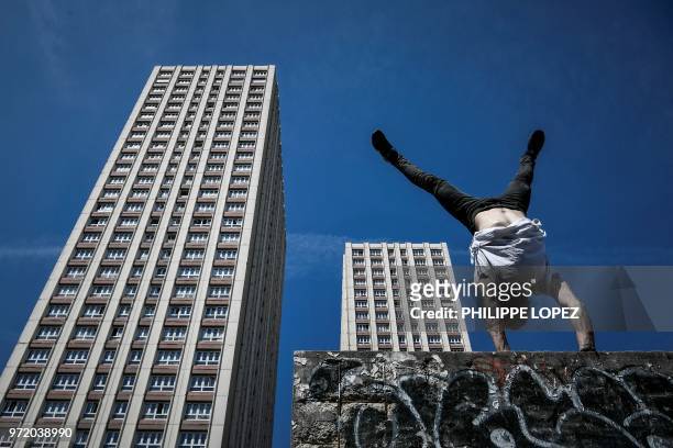 Johan Tonnoir, practices Parkour, an obstacle course method derived from military training "parcours du combattant" , on May 17, 2018 in Paris.
