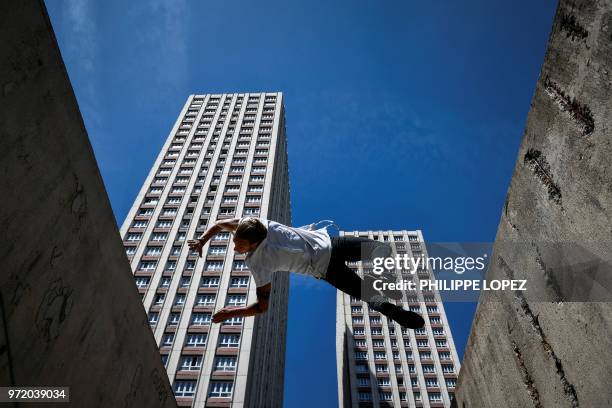 Johan Tonnoir, practices Parkour, an obstacle course method derived from military training "parcours du combattant" , on May 17, 2018 in Paris.