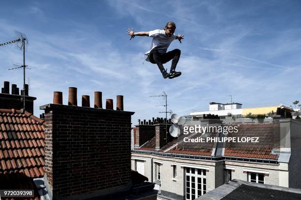 Johan Tonnoir, practises Parkour, an obstacle course method derived from military training "parcours du combattant" , on May 17, 2018 in Paris as the...
