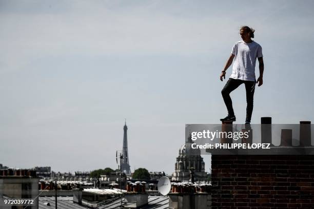 Johan Tonnoir, poses while practising Parkour, an obstacle course method derived from military training "parcours du combattant" , on May 17, 2018 in...