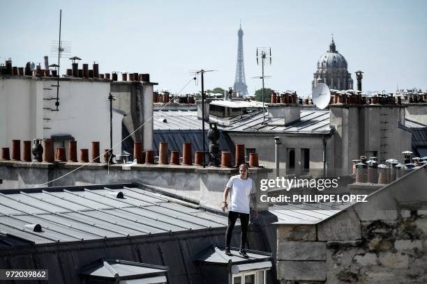 Johan Tonnoir, poses as he practices Parkour, an obstacle course method derived from military training "parcours du combattant" , on May 17, 2018 in...