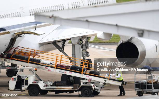 England's bags are loaded to the plane at Birmingham Airport, ahead of the team flying out to Russia for the 2018 FIFA World Cup.