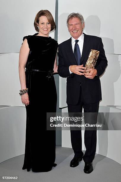 Actor Harrison Ford pose in Awards Room after he received Honour Cesar Award from actress Sigourney Weaver during 35th Cesar Film Awards at Theatre...