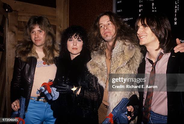 Ted Nugent with Ann Wilson from Heart holding toy guns after his show in New York in 1978