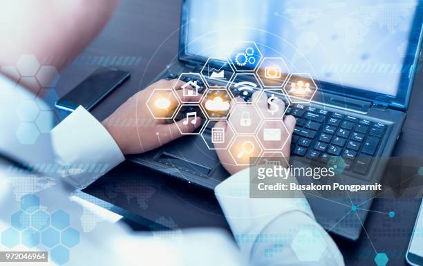businessman hand working with laptop computer  with technology digital graphic - mentoring virtual stock pictures, royalty-free photos & images