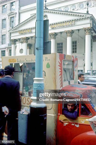 England, indian mobile snackbar in Haymarket, London. In the background, Haymarket Theatre.