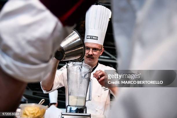 Finland's Ismo Sipelainen competes during the event of the Bocuse d'Or Europe 2018 International culinary competition, on June 12, 2018 in Turin.