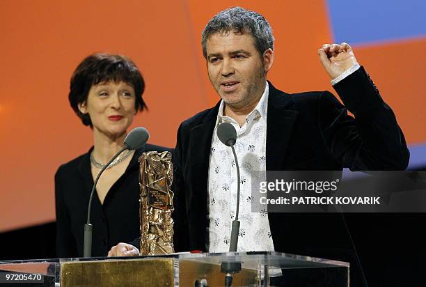 Stephane Brize gives a speech near Florence Vignon after they received the award of the best adaptation during the 35th Cesars French film awards...