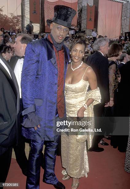 Athlete Dennis Rodman and Actress Vivica A. Fox attend the 69th Annual Academy Awards on March 24, 1997 at Shrine Auditorium in Los Angeles,...