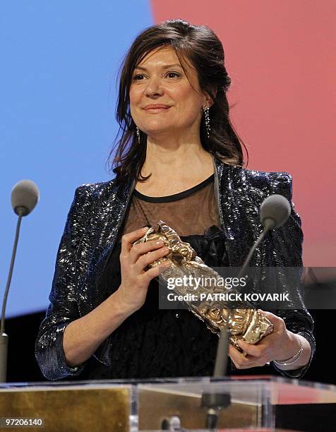 French producer Anne-Dominique Toussaint poses with award of the best first film for the movie "Les beaux gosses" directed by Riad Sattouf during the...