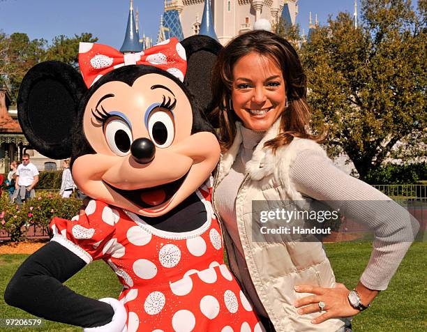 In this handout photo provided by Disney, Actress Eva La Rue, star of the CBS series "CSI: Miami," poses with Minnie Mouse at the Magic Kingdom on...