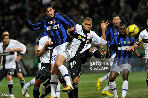Picture taken on February 10, 2010 in Parma, shows Inter Milan's Diego Milito fighting for the ball with Parma's Jonathan Biabiany during their...