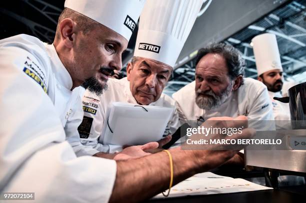 Italy's committee member Enrico Crippa shows the Italian menu during the event of the Bocuse d'Or Europe 2018 International culinary competition, on...