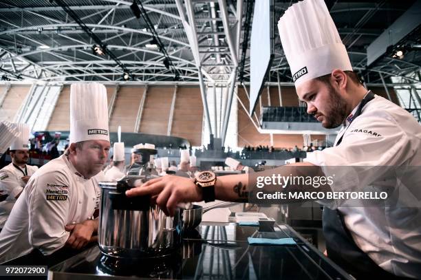 Norway's Christian Andre Pettersen and his coach Gunnar Hvarnes compete during the event of the Bocuse d'Or Europe 2018 International culinary...