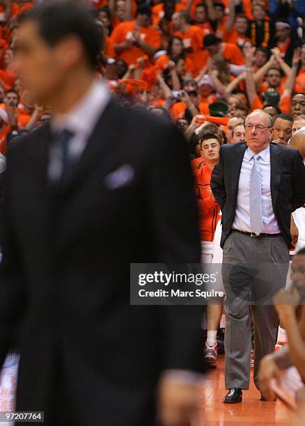 Coach Jim Boeheim of the Syracuse Orange looks on as Coach Jay Wright of the Villanova Wildcats stands in the foreground during the game at the...