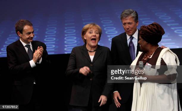 German Chancellor Angela Merkel laughs as Spanish Prime Minister Jose Luis Rodriguez Zapatero , Bill McDermott, chairman of the German software giant...