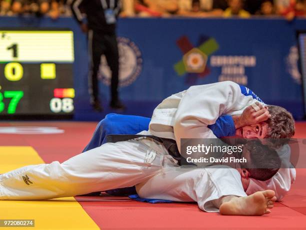 Falk Petersilka of Germany holds Li Kochman of Israel for an ippon to win their u90kg round two contest during day three of the 2018 Tel Aviv...