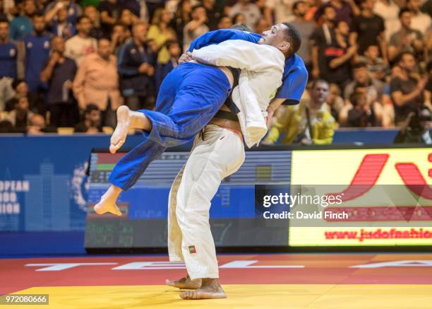 Daniel Mukete of Belarus throws Aaron Fara of Austria for an ippon to win the o100kg semi-final during day three of the 2018 Tel Aviv European Judo...