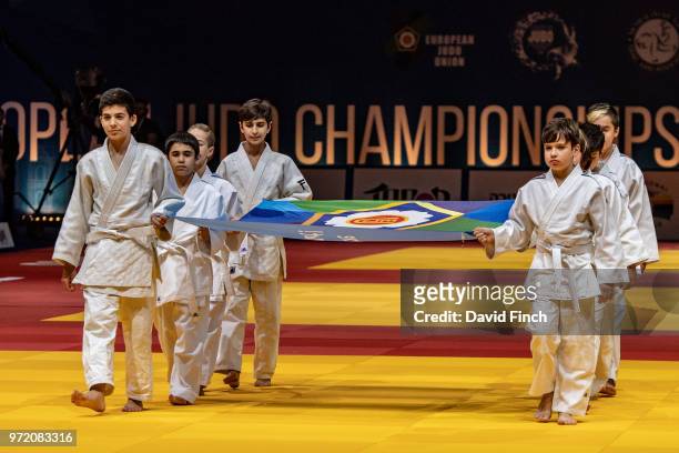 Israeli young boys and girls proudly carry the European Judo Union flag to be handed to the President of the Belarusia Judo Federation, Mr Pavel...