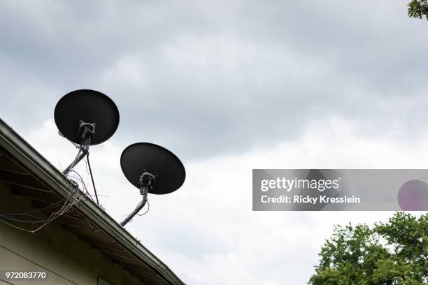 satellite dishes on roof - woodbridge virginia stock pictures, royalty-free photos & images