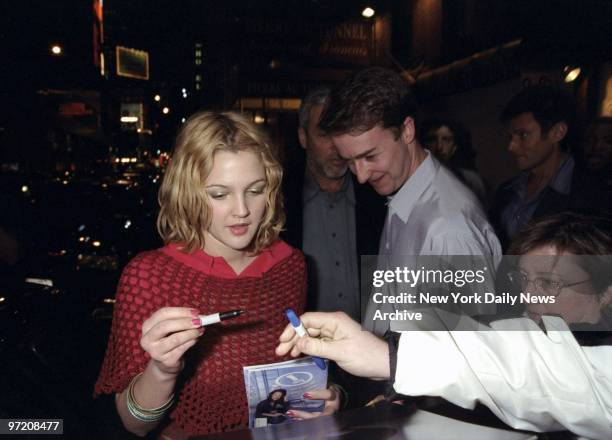 Actress Drew Barrymore obliges with an autograph at the opening night performance of "The Iceman Cometh" at the Brooks Atkinson Theater.,
