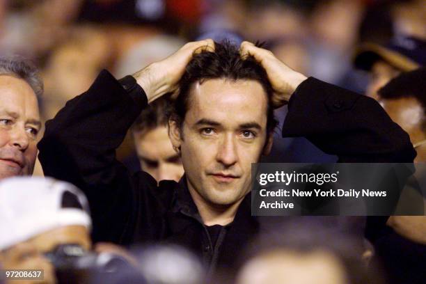 Actor John Cusack at Game 3 of the World Series between the New York Yankees and Atlanta Braves at Yankee Stadium.