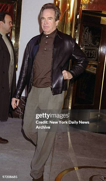 Actor Warren Beatty leaves the Russian Tea Room after lunching with his wife, Annette Bening, and two of their children.