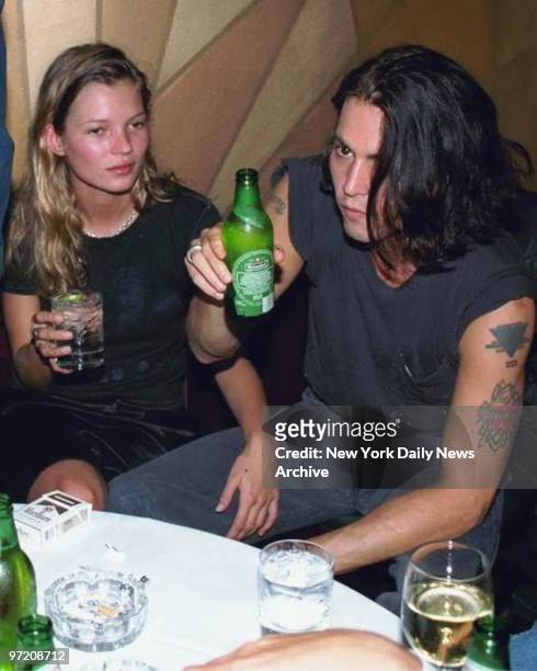 Actor Johnny Depp and girlfriend supermodel Kate Moss, at the thirty-eighth birthday party thrown by Depp for fellow iconoclastic actor Mickey Rourke...