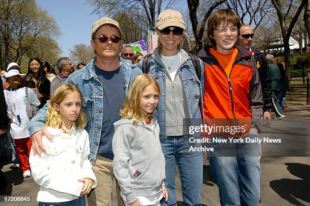 Actor Michael J. Fox, wife Tracy Pollan, twin daughters Aquinnah and Schuyler and son Sam make their way through Central Park during the 11th annual...