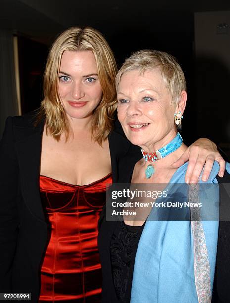 Actress Kate Winslet gets together with Dame Judi Dench at the world premiere of the movie "Iris" at the Paris Theater. They star in the film.