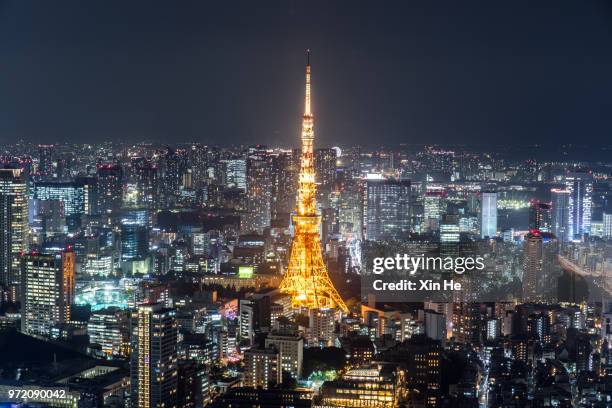 busy streets in tokyo and the view of tokyo tower / tokyo, japan - xin he stock pictures, royalty-free photos & images