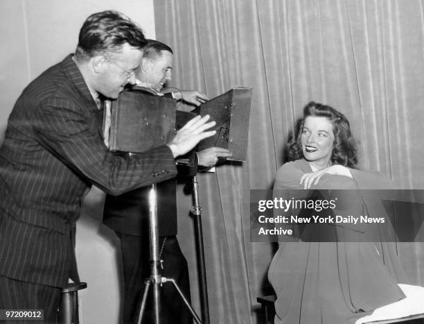 Actress Katharine Hepburn with Daily News photographers Harry Warnecke and Robert Cranston.