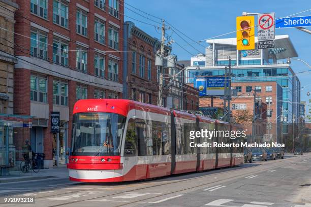 toronto canada: bombardier flexity outlook streetcar in  king street east - ttc stock pictures, royalty-free photos & images