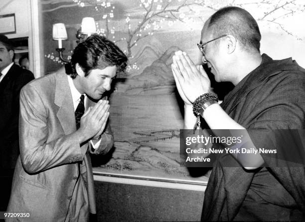 Actor Richard Gere exchanging greetings with the Dalai Lama of Tibet.
