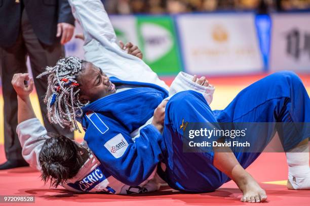 Romane Dicko of France holds Larisa Ceric of Bosnia and Herzegovina for an ippon to win the o78kg gold medal during day three of the 2018 Tel Aviv...