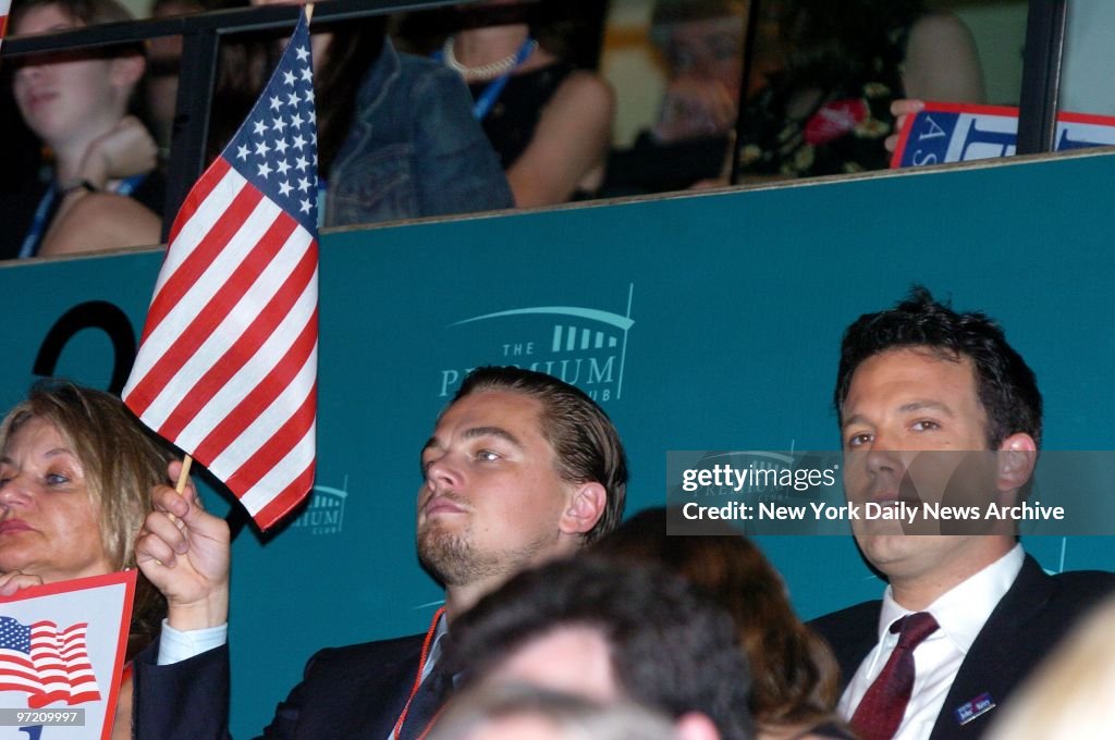 Actors Leonardo DiCaprio (left) and Ben Affleck listen to sp
